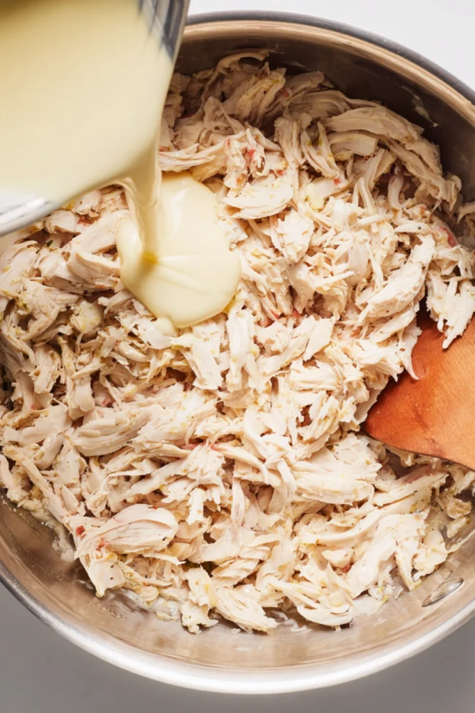 Shredded Chicken Enchiladas with Cheesy Sour Cream Sauce